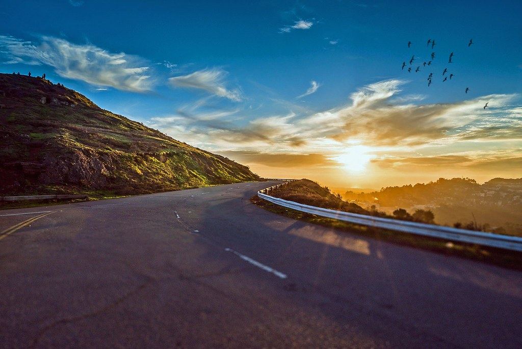 A winding mountain road at sunset